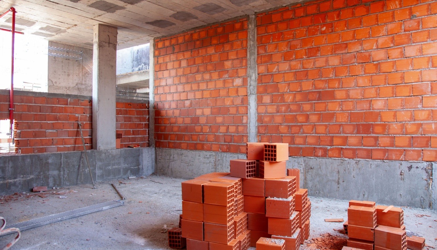 Stacked bricks ready for construction; supply chain software solutions concept