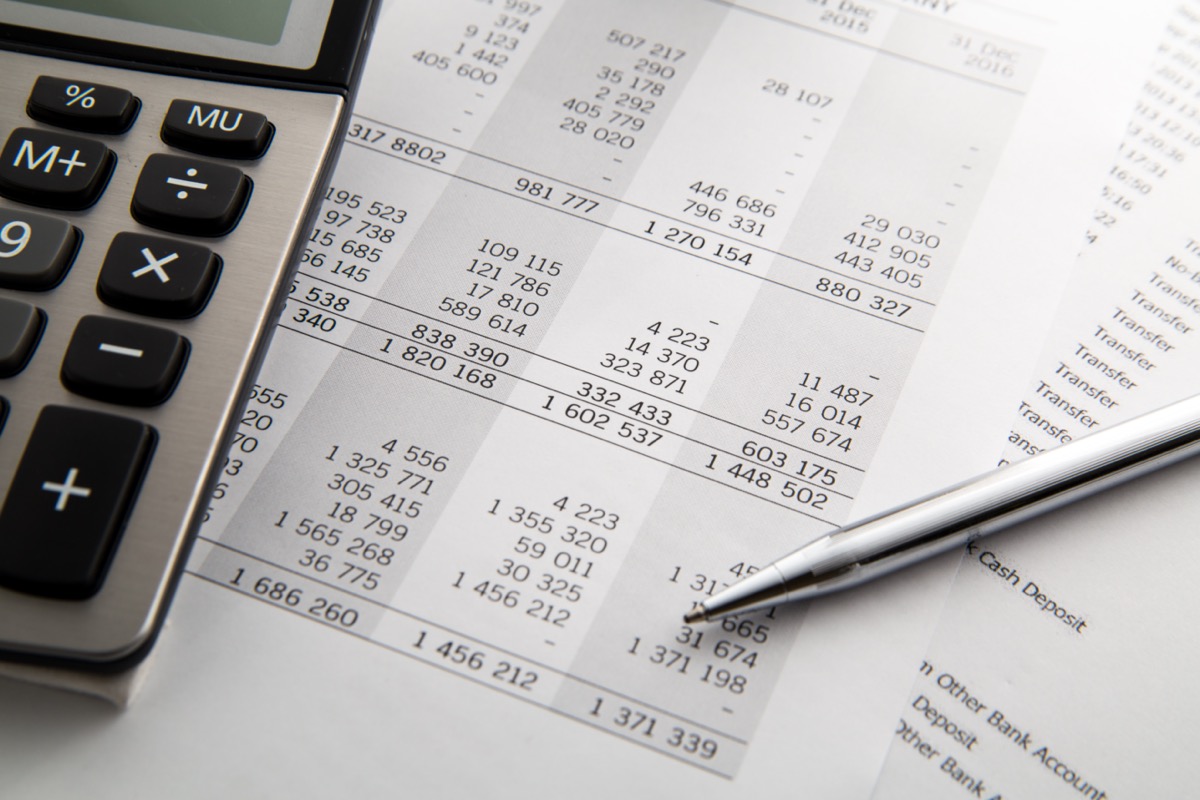 Pen, calculator On the financial account documents. Financial concept