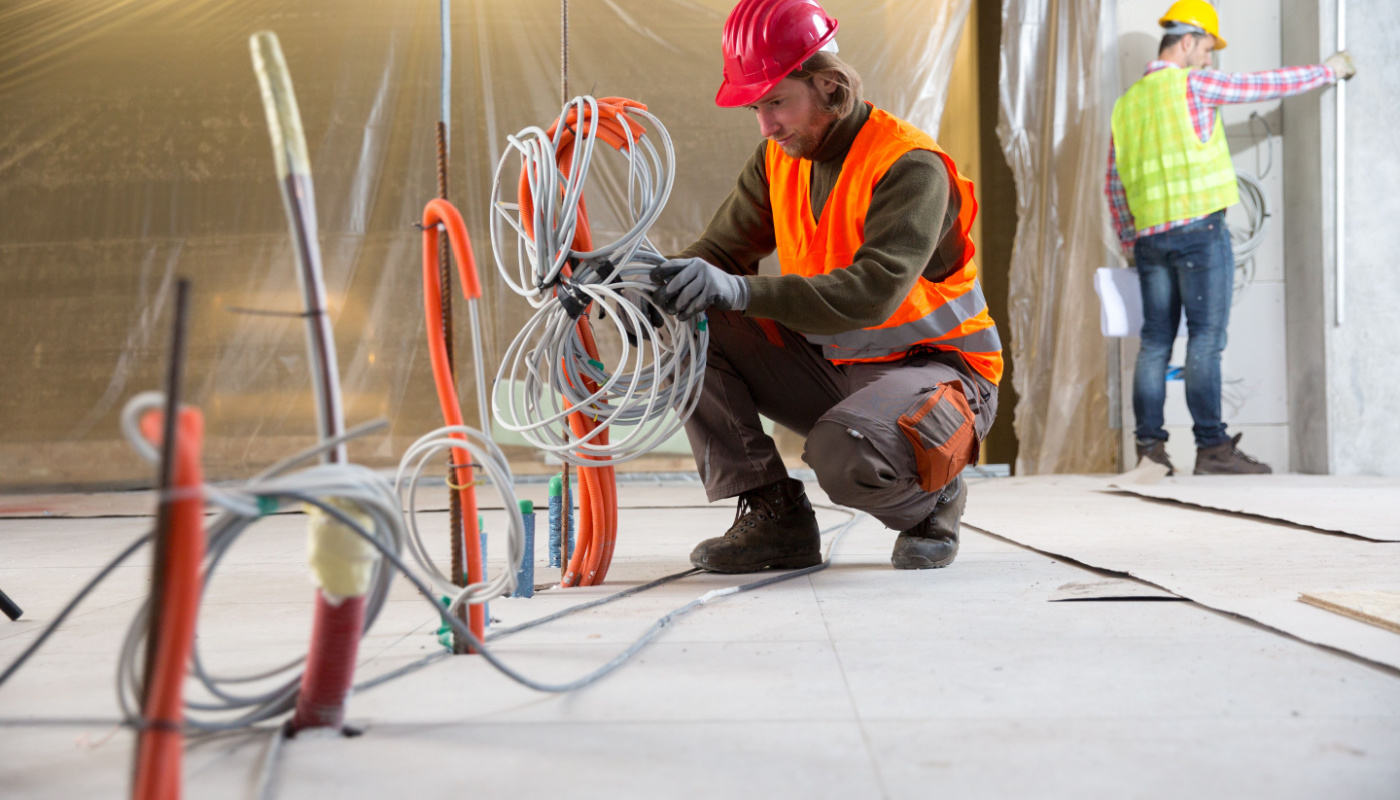 Workers at a construction site; rework concept